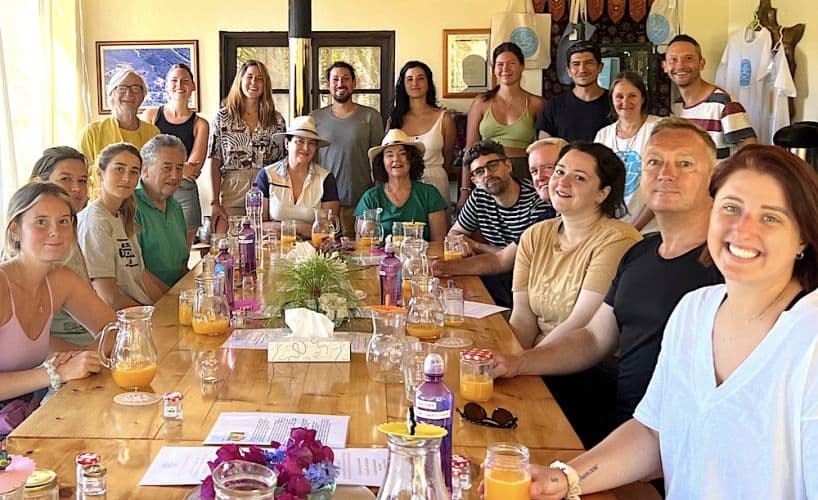 Guests gathered around the long table for the group breakfast